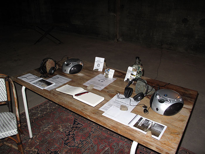 Djúpavík. Exhibition "Pictures - and their sounds" in the old herring factory. - CD-Player, photography books and several informations on a table... (20 June 2010)
